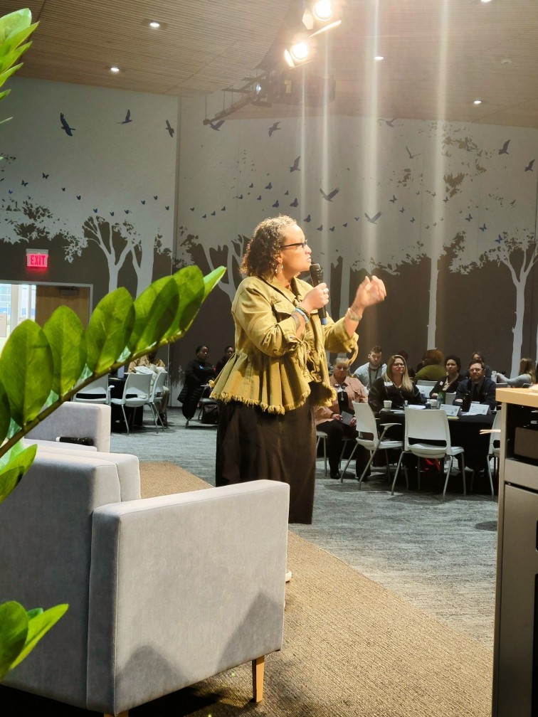 Photo of a woman speaking to an audience